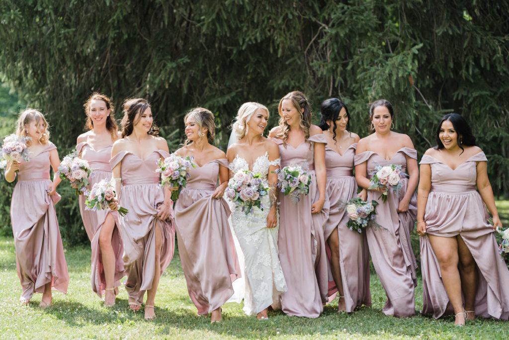 Loverly Weddings Bridesmaid's walking and laughing 